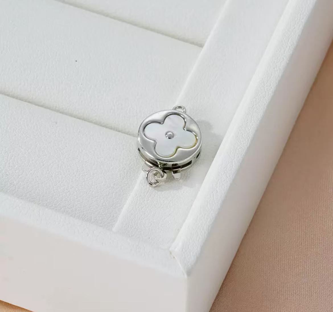 GA 18K gold-plated white gold finish, silver chain, and pearl necklace clasp.