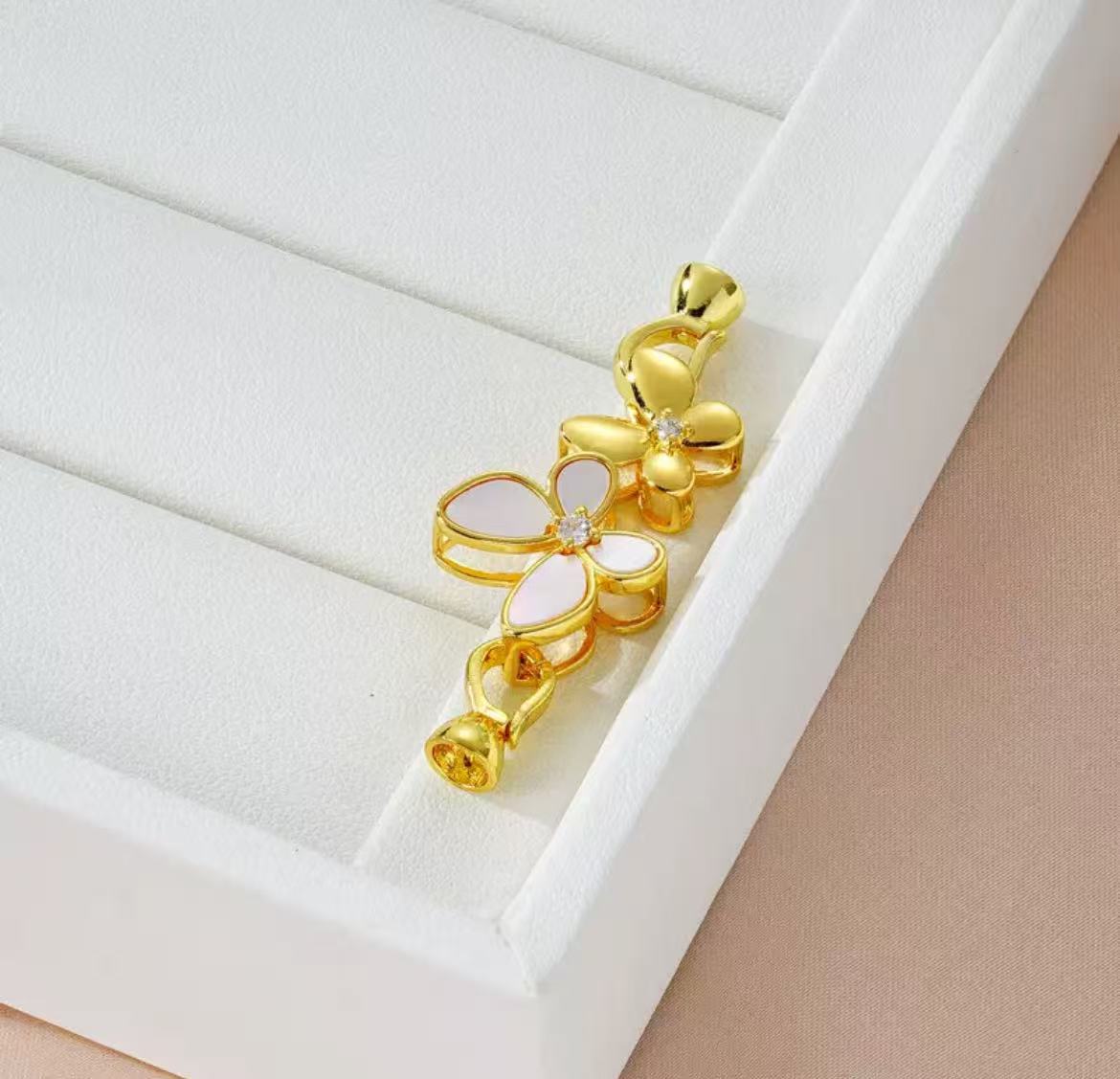 GA 18K gold-plated white gold finish, silver chain, and pearl necklace clasp.